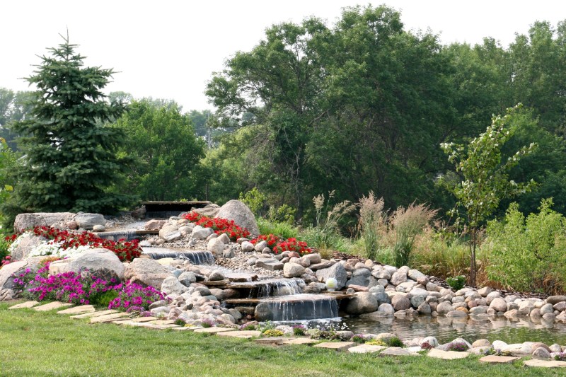 The view from the patio is this newly-completed waterfall and pond. Beautiful.