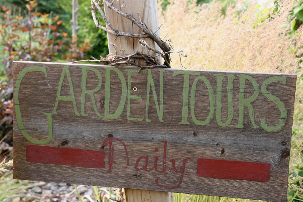 Flowers, garden tours sign