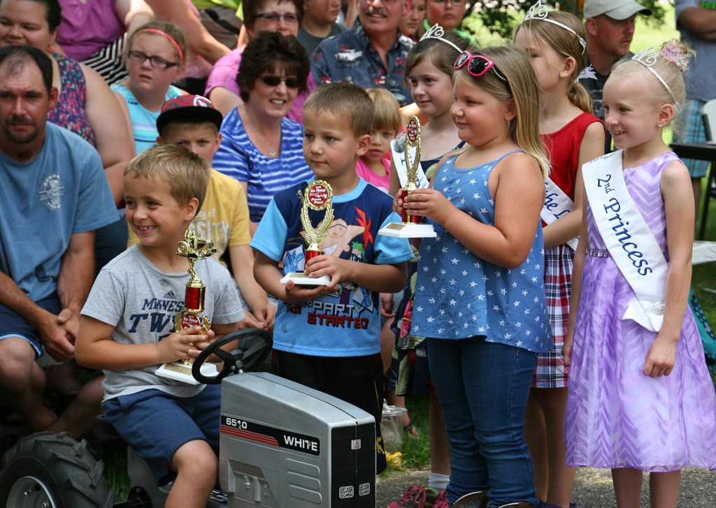 Princesses and winners pose for photos.