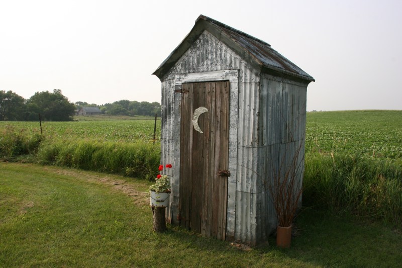 Brian and Vicki recently added an outhouse (used for storage) to their property. This reminds me of the first 11 years of my life, living in a house without a bathroom and using a two-holer outhouse.