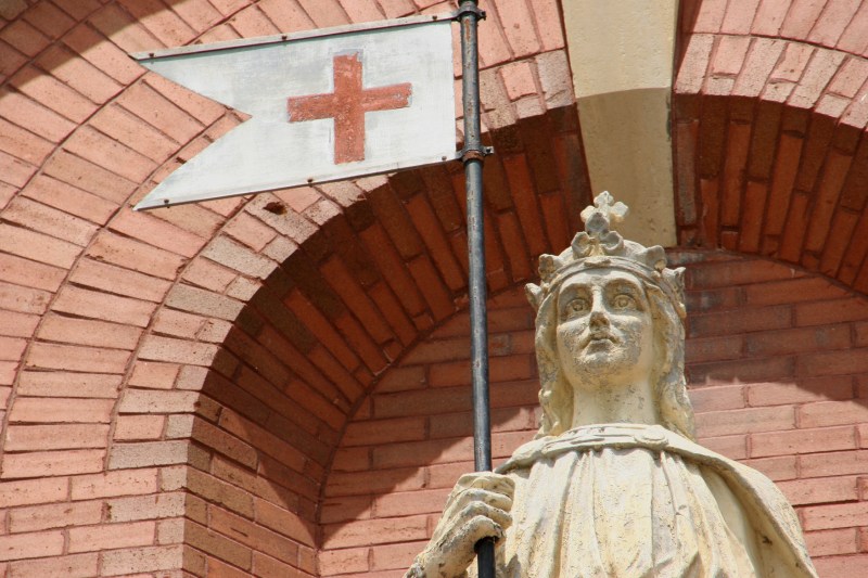 A close-up of the St. Wenceslaus statue above the main church entry.