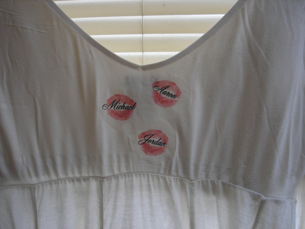The back of the shirt includes the names of Kay's three children. Kim found the lips blotted on a piece of paper in one of Kay's books. A Duluth printed printed them on the shirt. Kay kissed everything with her big pink lips, says her sister.