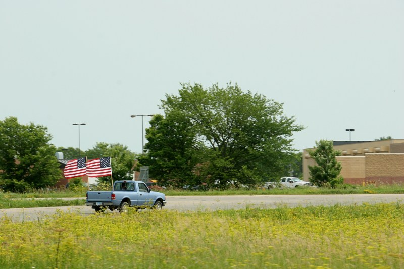 American flags a wavin', this truck takes the northbound entrance ramp onto Interstate 35 off Minnesota State Highway 60 Friday afternoon.