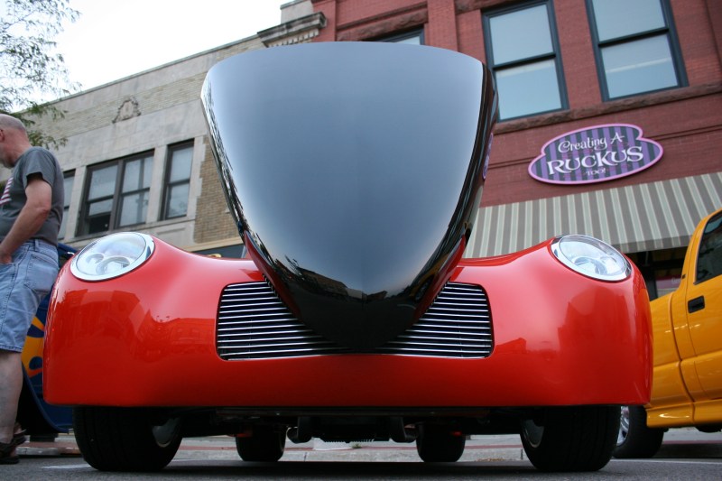 I set my camera on the street and tilted it up to take this shot. That's my husband on the left, already moving onto the next vehicle.
