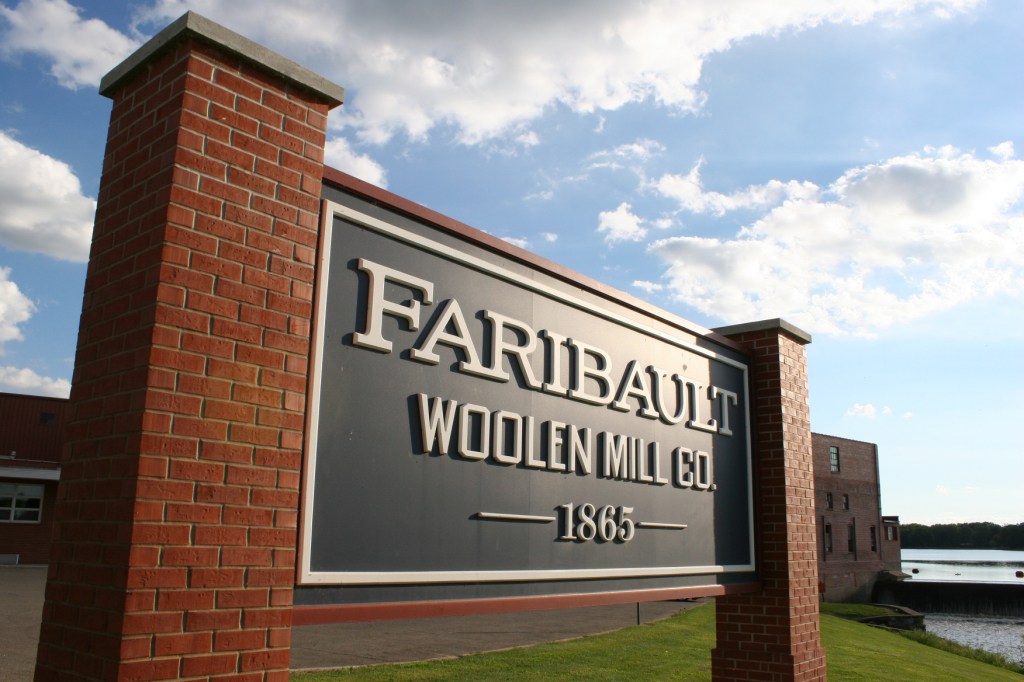 This sign marks The Faribault Woolen Mill, which sits along the banks of the Cannon River in Faribault, Minnesota.