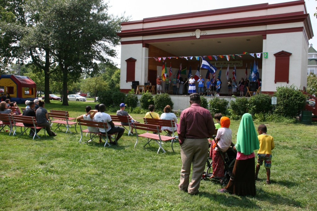 Attendees watch the flag ceremony staged in the Central Park Bandshell.