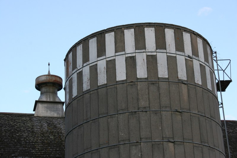 The top of the silo and the barn roof.