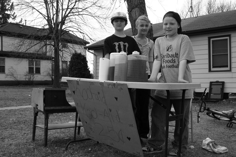 Quinlan, left; his sister, Jazmyn; and friend William sell lemonade on March 17, 2012. The boys were the primary sellers. Jazmyn assisted occasionally and popped in for the photo.