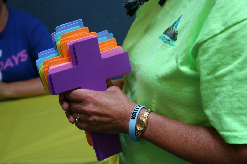 One of my favorite close-up VBS photos shows the VBS leader clutching crosses to be used in a craft project.