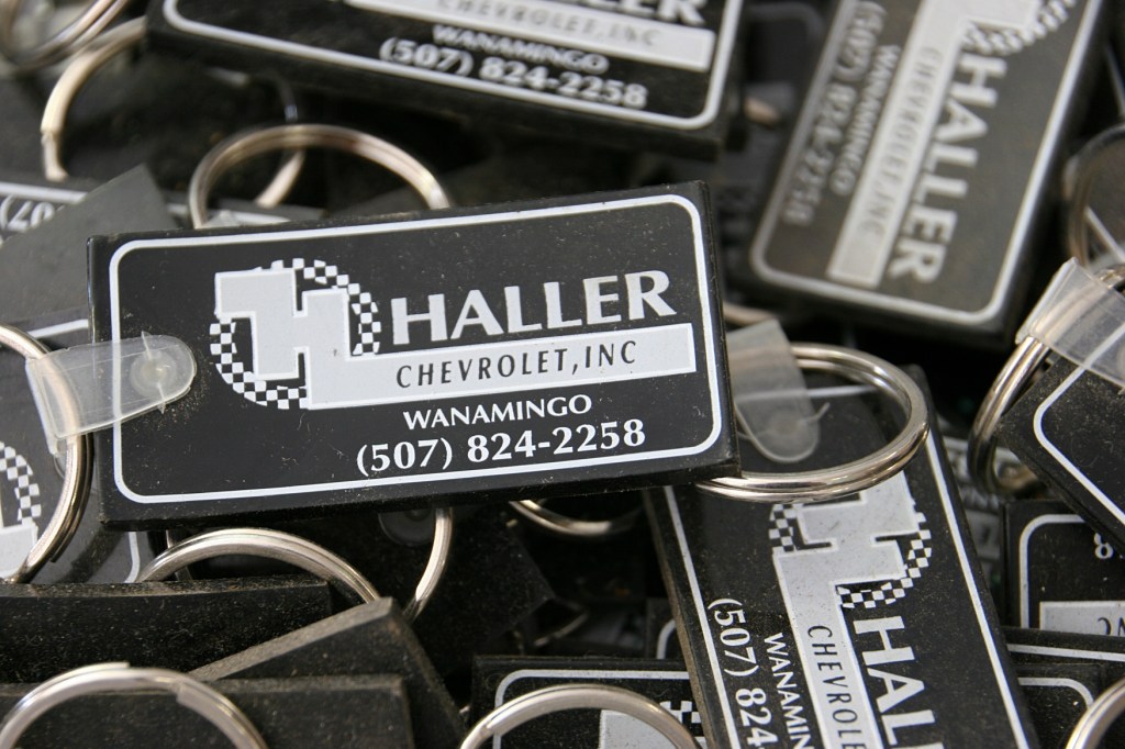 Woody has a box full of key chains from a now closed dealer.