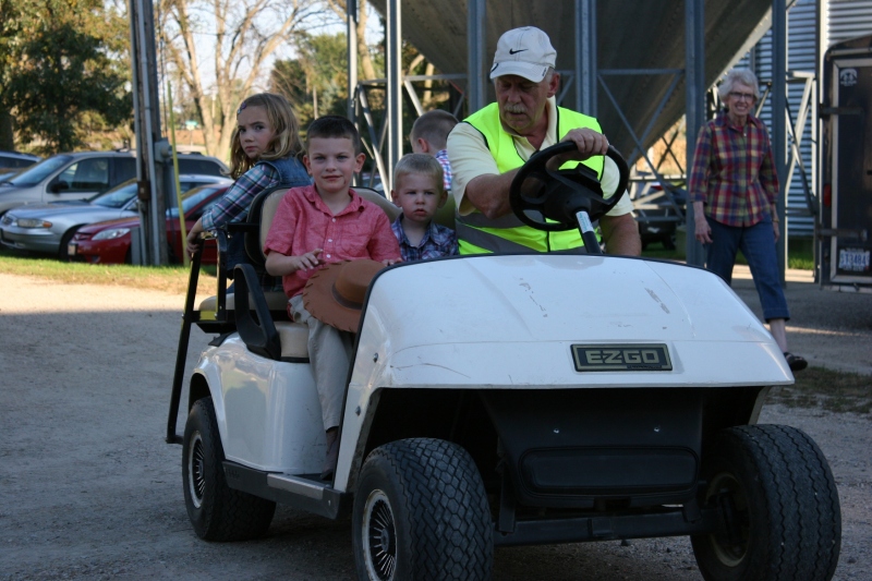 The kids all wanted rides on the golf cart.