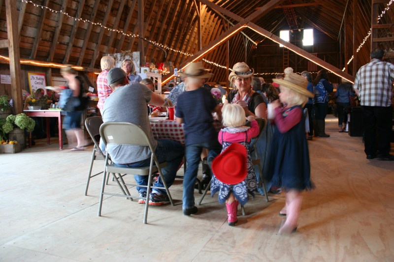 Grandparents build memories with grandchildren at the barn dance.