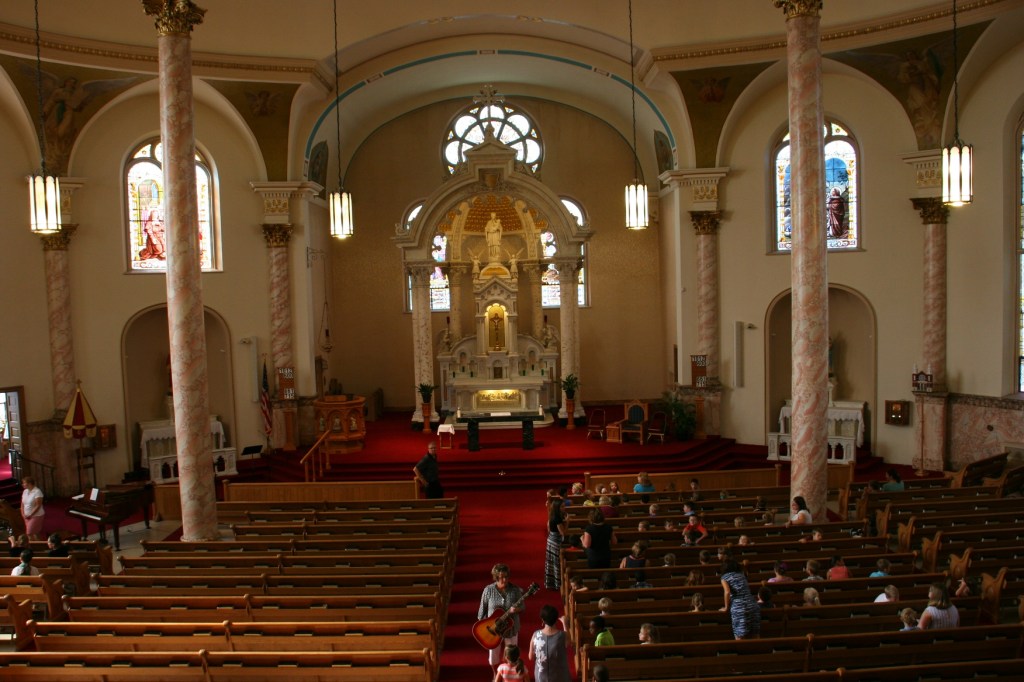 Students from the basilica's school file in for morning Mass.