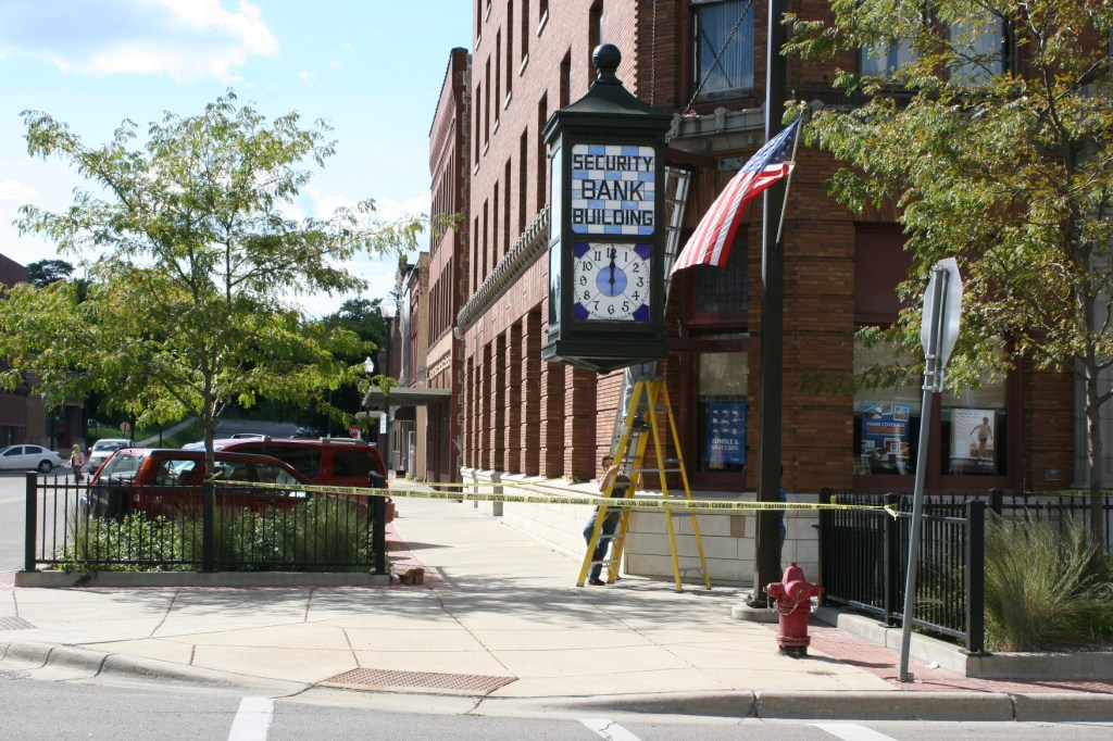 Mike's son, Charlie, waits at the bottom of the ladder.