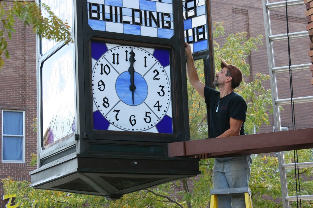 Another view of Mike Elwood working on the clock.