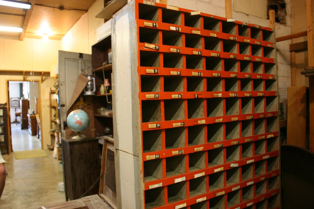 This cubby unit was among many many pieces of furniture crammed into a space between the showroom and the workshop.