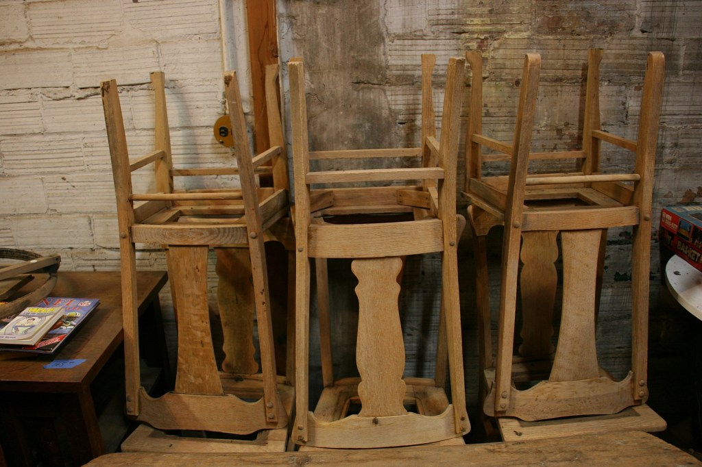 Everywhere there are works in progress, including these stripped chairs.