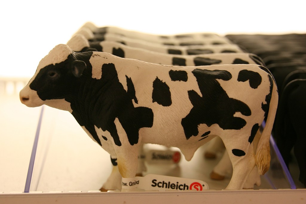 Rows and rows of Schleich animals fill shelves.