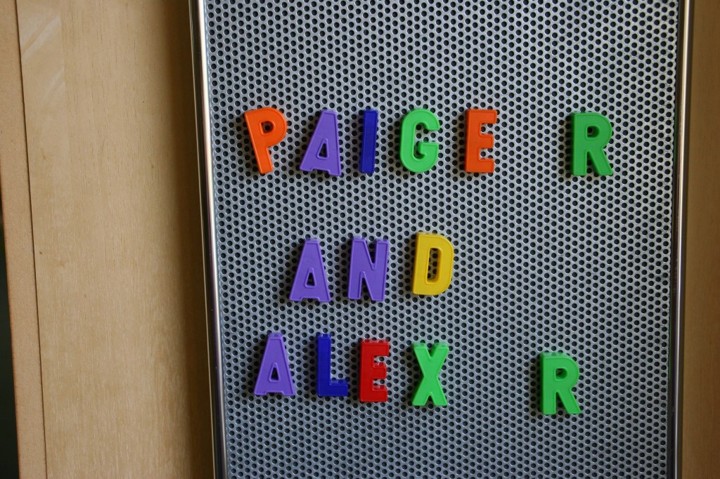 Kids left their signatures in magnetic letters.