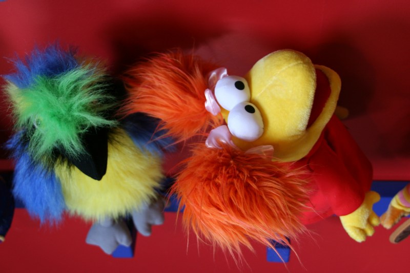 Playful puppets pop color into a section of the multi-room toy store.