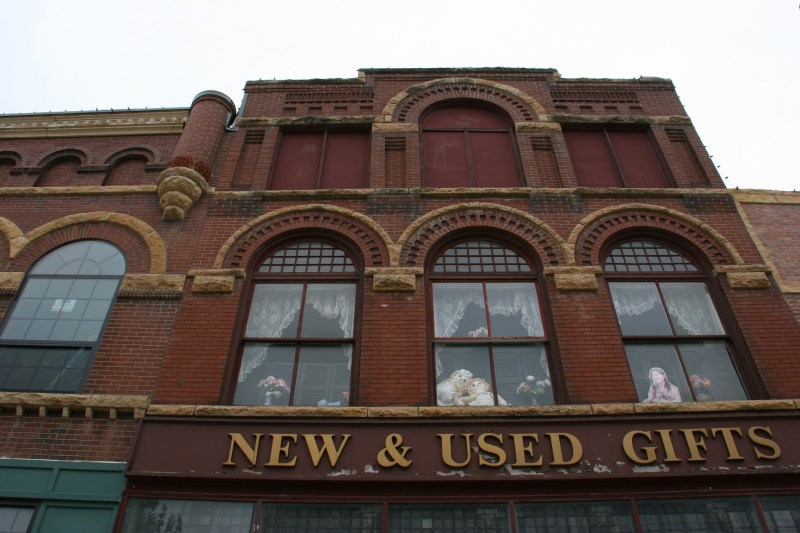 Second floor windows hint at what's inside the shop.