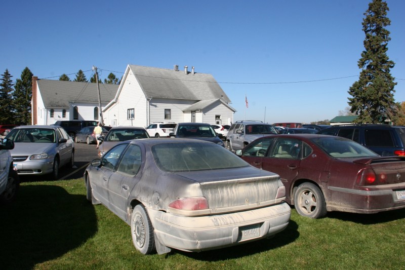 Vehicles ringed the church and school during Sunday's dinner.