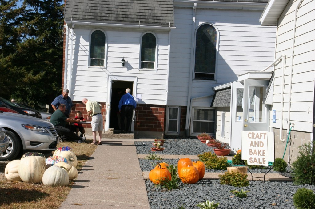 Volunteers sell tickets outside the church.