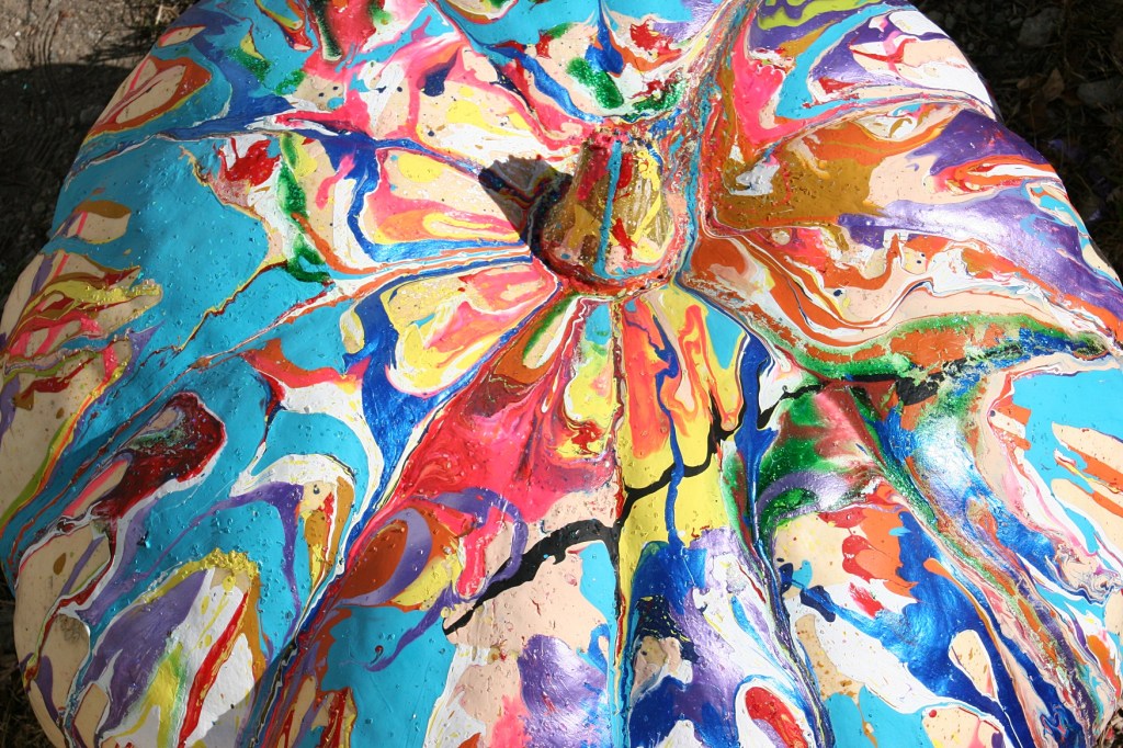 Gigantic painted pumpkins sat outside the church and school. Kids at the school painted pumpkins as part of art class.