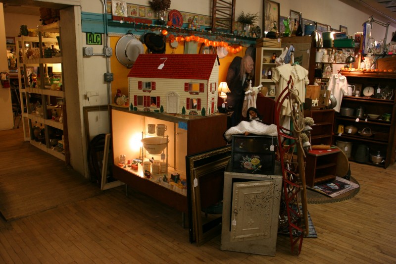 I spotted two vintage dollhouses, wishing I still had mine from my youth.