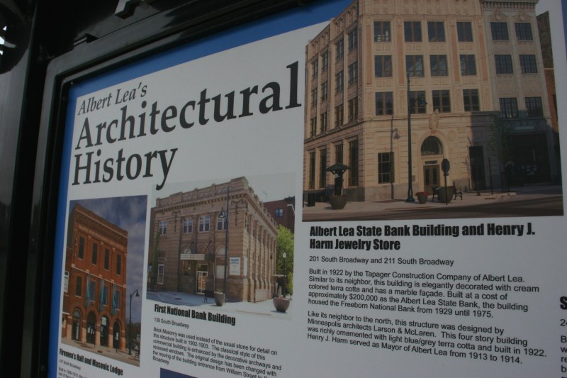 An informational kiosk in the downtown shares info about historic buildings.