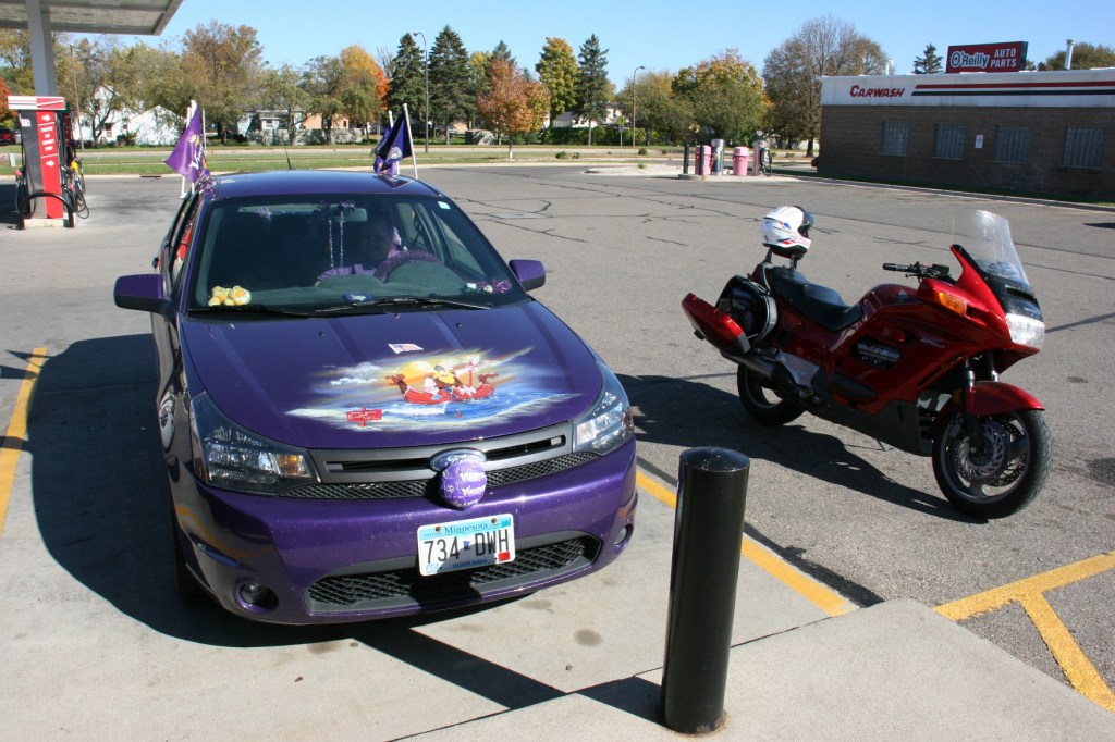 MN Vikings fan, 71 front of Vikings car