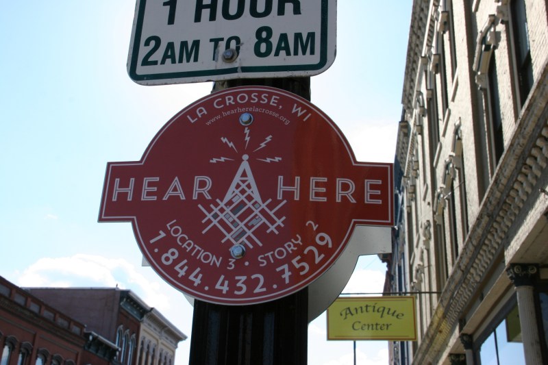 You can listen to everyday stories of the city by dialing the number posted on street level signs. In the audio, you'll hear first person accounts of events that happened at that exact location. Go ahead, dial the number seen in this image.