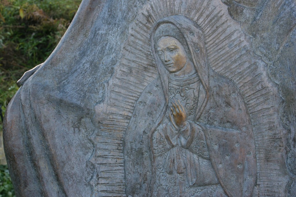 This image of the Lady of Guadalupe is woven into the Juan Diego statue.