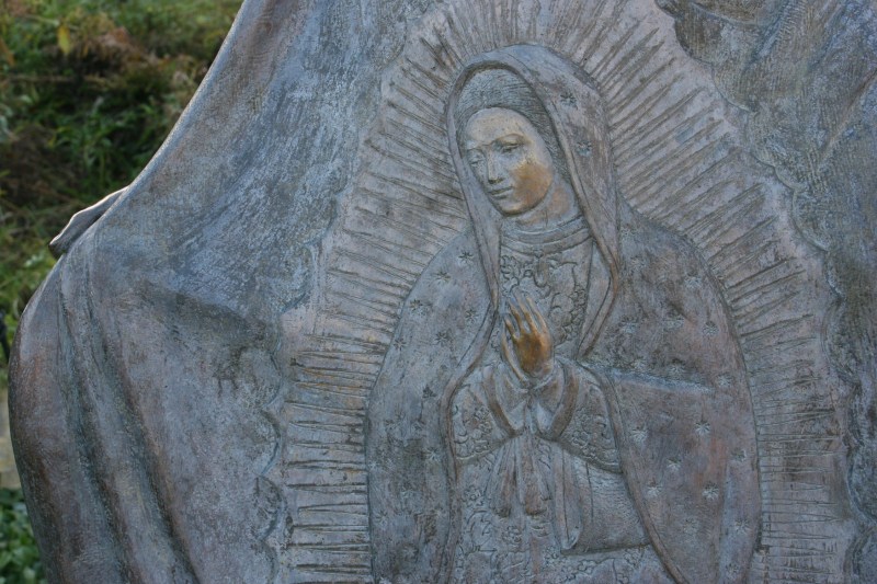 This image of the Lady of Guadalupe is woven into the Juan Diego statue.