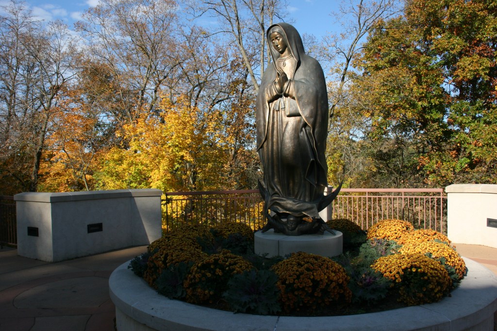 Outside the Pilgrim Center rests this sculpture of the Lady of Guadalupe.