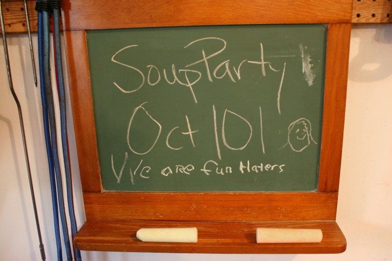 A sarcastic message chalked on a board in the garage.