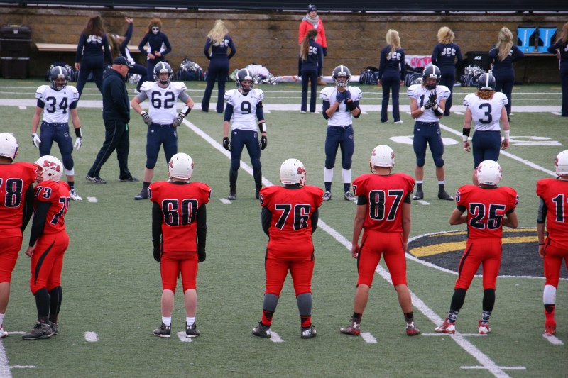 The St. Croix Valley Crusaders and the Jackson County Central Huskies line up before the game starts Saturday afternoon.