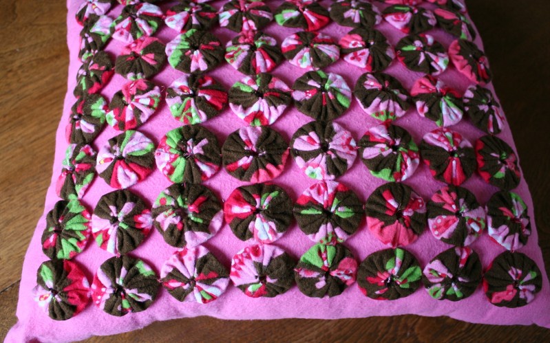 My niece worked all last winter stitching these yo-yos for this pillow.