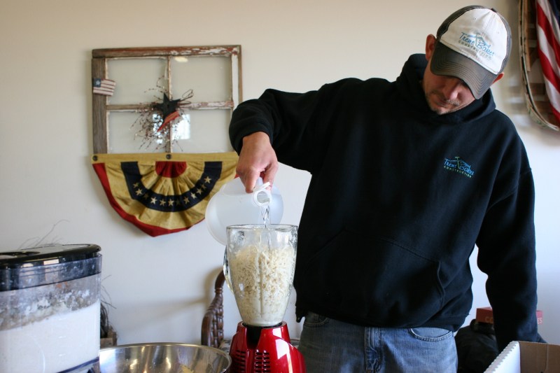 My nephew adds vinegar (it's by guess, not measurement) to the horseradish before blending.