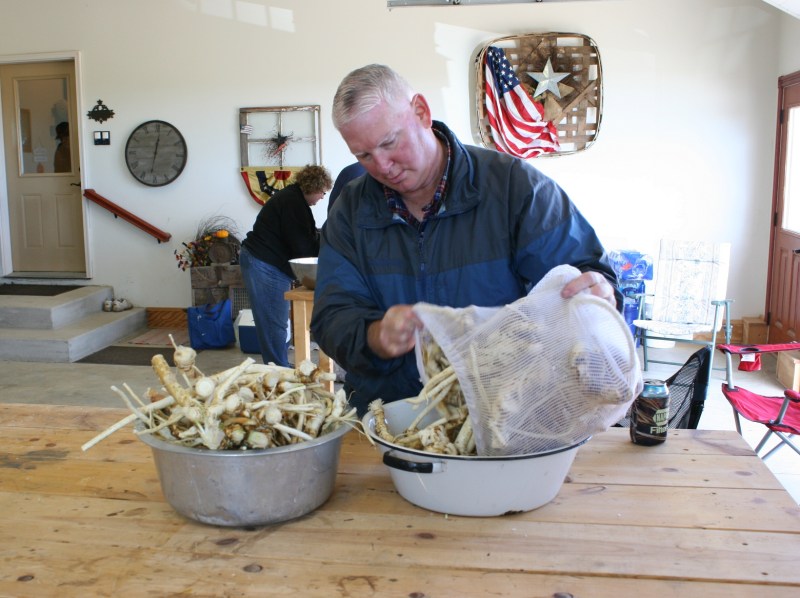 My brother empties the second laundry bag.