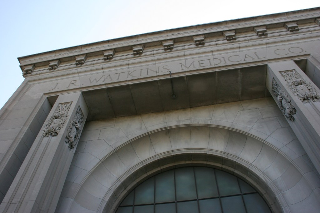 Chiseled above the main entry into the administrative building.