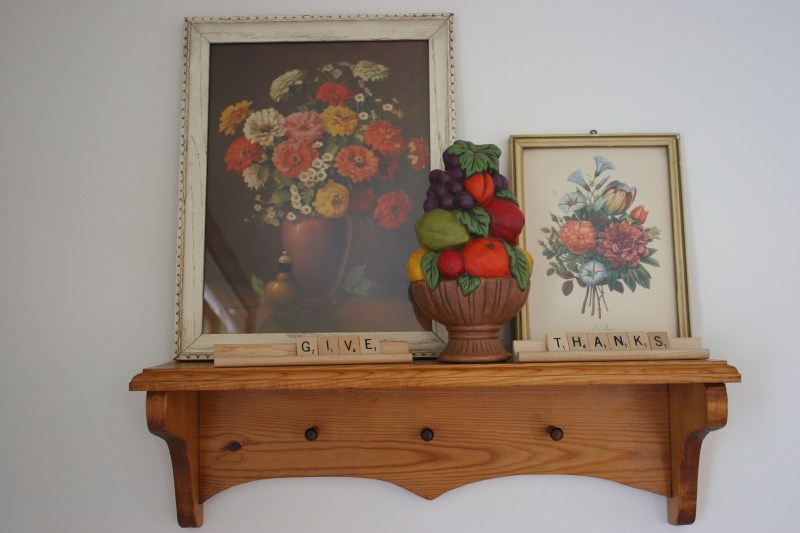 Given my love of words, I created this Thanksgiving display with thrift store art purchases and Scrabble letters.