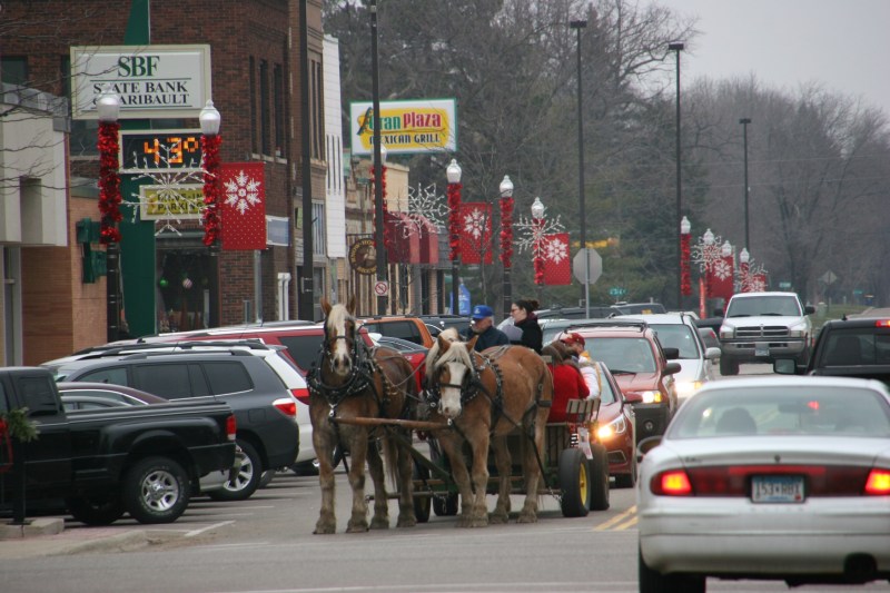Mike Fuchs guides his team or horses southbound on Central Avenue in historic downtown Faribault late Saturday afternoon.