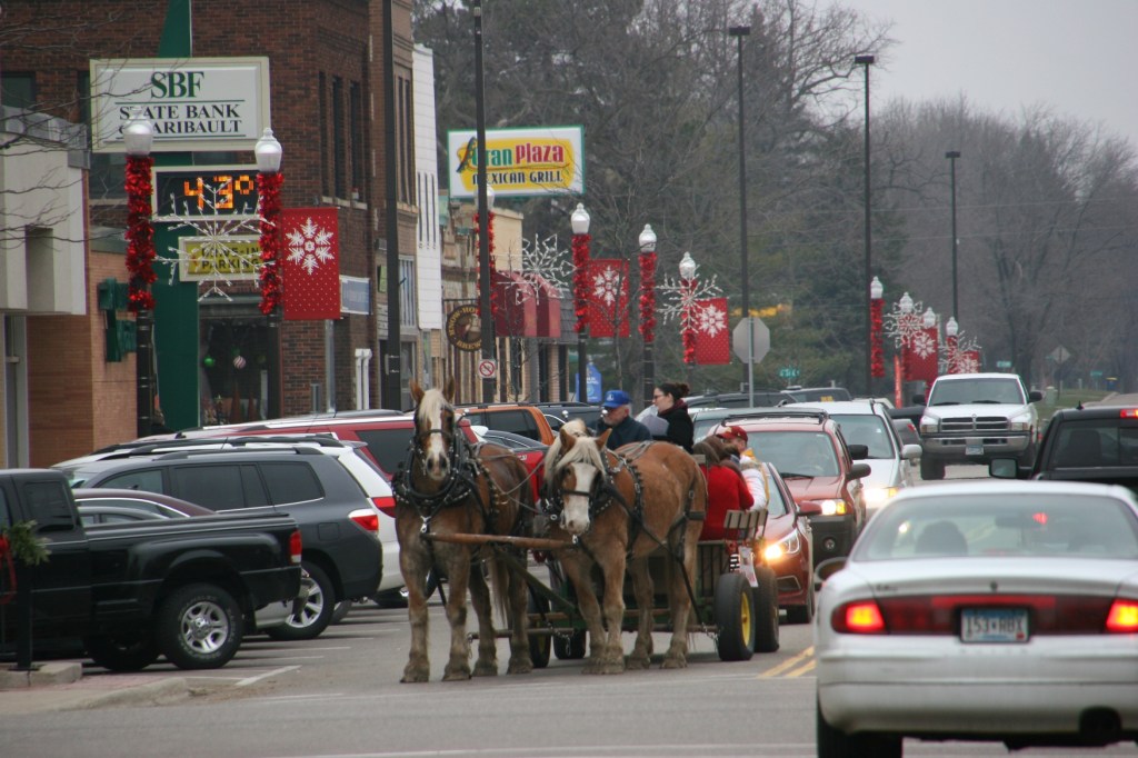 Mike Fuchs guides his team or horses southbound on Central Avenue in historic downtown Faribault late Saturday afternoon.