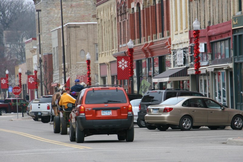 Santa's horse-drawn wagon, 92 red car following