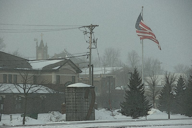 Saturday afternoon in Montgomery, fierce wind whipped this over-sized flag and a light snowfall.