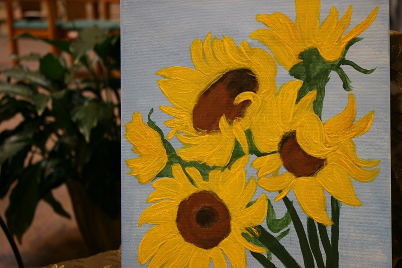 A painting of sunflowers jolted color