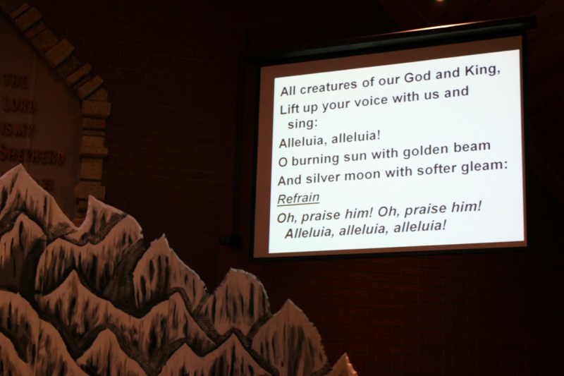 Worship opened with the hymn, "All Creatures of Our God and King," shown on the big screen next to a mountain crafted for the 2015 Mt. Everest themed Vacation Bible School.
