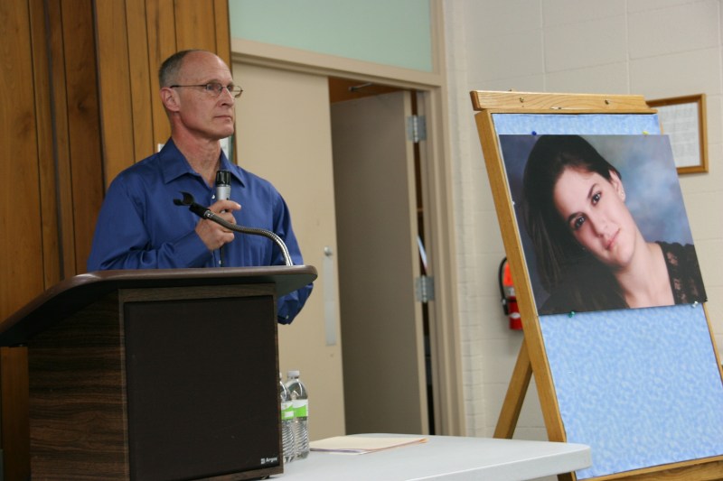 Dan Kasper next to a portrait of Becky.