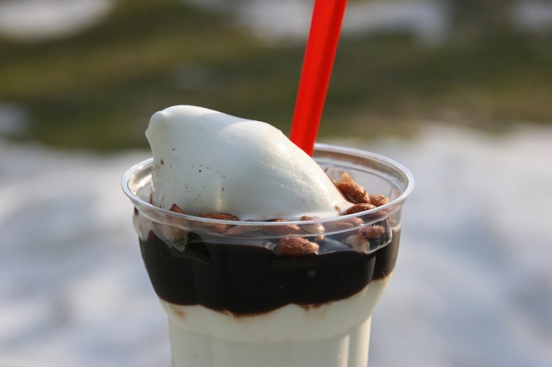I set my peanut buster parfait on a table in my patio to show the backyard contrast of seasons. The white background patches are snow, the green, lawn.